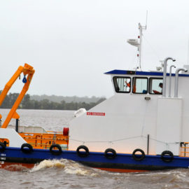 Self propelled multi-purpose work boat