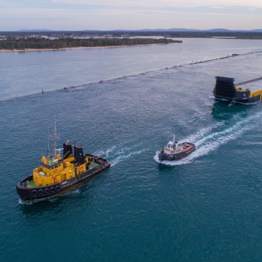 Tugs working with completd barge